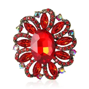 Luxurious vintage flower brooch featuring radiant red rhinestones and crystal accents