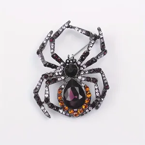 Detailed front view of a vintage alloy spider brooch featuring purple and amber rhinestones
