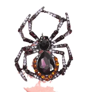 Vintage black crystal spider brooch with sparkling purple rhinestone accents for women