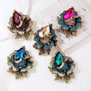Elegant vintage style flower brooches with teardrop crystals in five vibrant colors