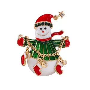 Broche bonhomme de neige de Noël festive avec strass et décorations de chaussettes rouges