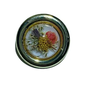 Vintage French style gold-edged circular resin earrings featuring delicate real dried flowers