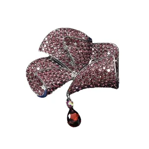Elegant vintage bow brooch with purple rhinestones and red teardrop crystal pendant charm