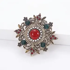 Elegant vintage ornate brooch with red and green stones for women coats and lapels