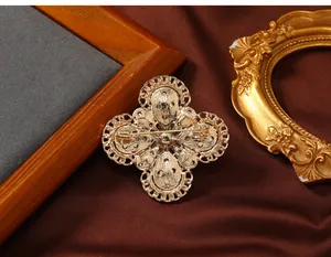 Detailed back view of vintage gold flower brooch with intricate metalwork and pin