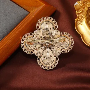 Vintage gold-plated flower brooch pin for women shown from the reverse side details