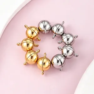Detailed view of polished gold and silver round magnetic clasps for DIY jewelry