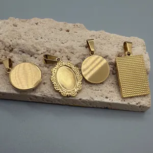 Detail view of four retro stainless steel golden pendants with various textured surfaces