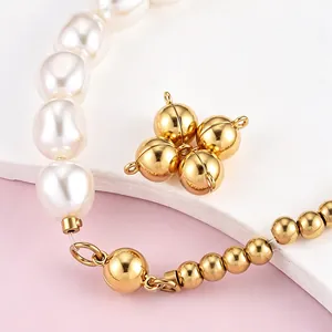 Close-up of professional polished gold magnetic jewelry clasp on pearl and bead bracelet