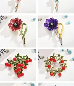 Collection of elegant floral and berry alloy brooches featuring vibrant enamel finishes