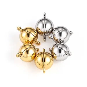 Polished round magnetic clasps for DIY jewelry in gold and silver finish on white.