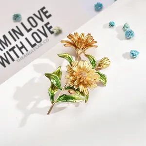 Elegant golden flower brooch with green leaves floral enamel pin for women
