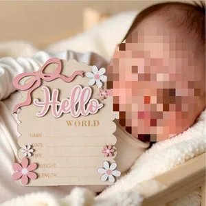 Personalized wooden newborn birth announcement plaque with pink bow and floral design
