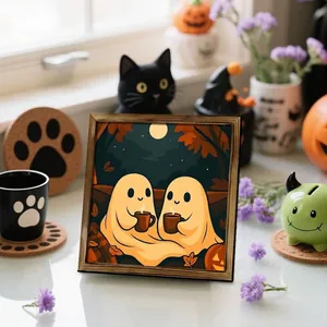 Cozy Halloween ghost framed wall art featuring cute spirits with coffee mugs on a window sill decor