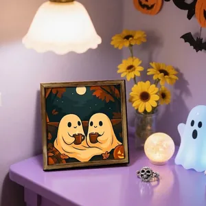 Halloween themed square framed wall art featuring two ghosts having coffee under the moon