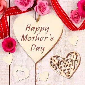 Macro detail of rustic heart-shaped wooden pieces with Happy Mother's Day engraving.