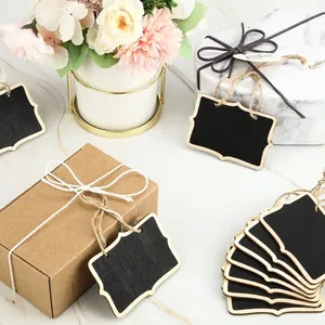 Vintage style mini wooden chalkboard tags with hemp rope hanging on kraft gift boxes