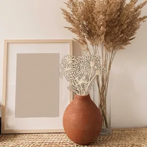 Laser-cut wooden wildflower crafts for natural home decoration in a ceramic vase
