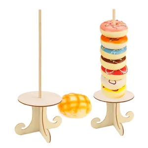 Detail view showing two wooden donut stands for wedding and party dessert displays.