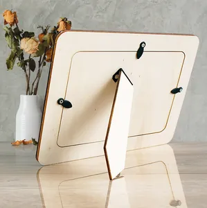 Detailed view showing the back support and clips of a raw wooden DIY photo frame.