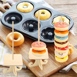 Wooden donut display stands shown with colorful donuts on a rustic kitchen setting