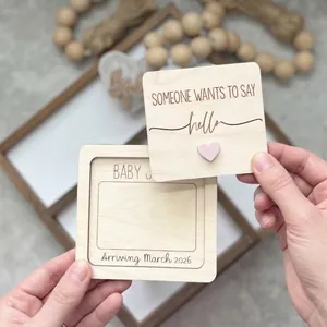 Custom wooden baby pregnancy announcement milestone card with pink heart detail.