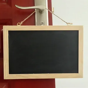 Decorative hanging wooden frame chalkboard suspended by a rope on a door handle