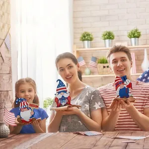 Detail of patriotic wooden gnome table decorations with Independence Day themes