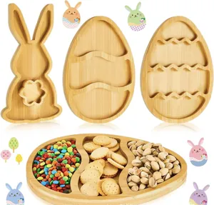 Set of Easter-themed bamboo serving trays shaped like bunnies and eggs with compartments
