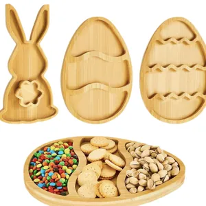 Sustainable bamboo Easter bunny and egg-shaped snack serving trays for fruits and nuts.