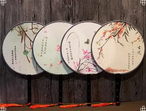 Set of traditional Chinese round fans with floral patterns and tassels