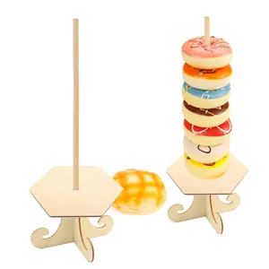 Two wooden donut display stands with hexagonal base for festive party table decorations