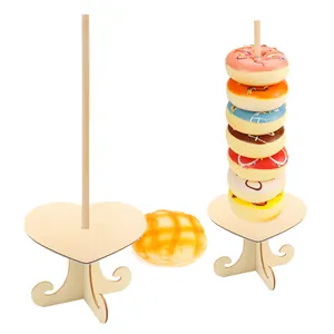 Set of two heart-shaped wooden donut stands for wedding and birthday party table decor