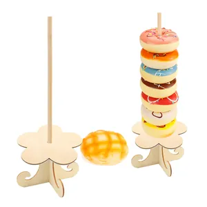 Detailed view of wooden donut display stand with flower shaped base for party decoration