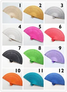 Twelve colorful wooden folding fans with intricate hollowed-out patterns in candy colors