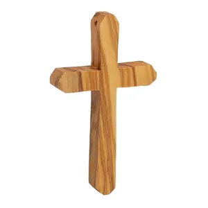 Handmade olive wood cross pendant necklace featuring natural wood grain on a white background