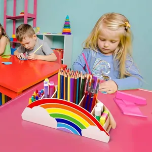 Detailed view of the cute rainbow wooden desktop organizer holding colorful art supplies