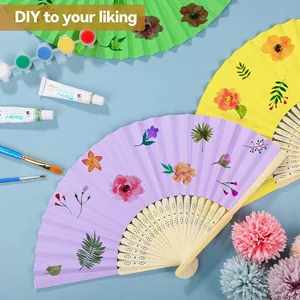 Detailed view of DIY hand-painted colorful paper fans featuring vibrant floral patterns