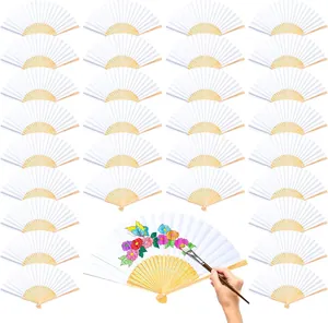 Collection of blank white paper folding fans shown with artistic DIY painting detail