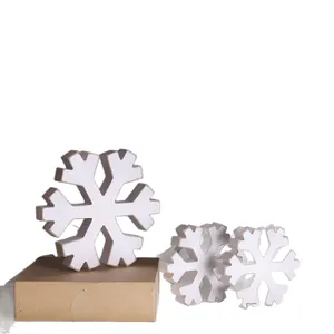 Set of three white wooden snowflake ornaments for rustic winter Christmas decor