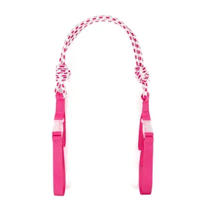 Detailed view of pink nylon extension strap featuring plastic buckles and patterned rope