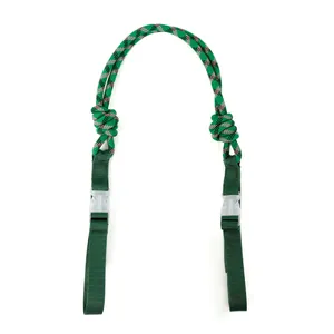 Detailed macro view of green patterned woven nylon strap with clear plastic buckles