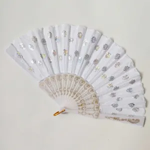 Detailed view of white Spanish folding fan with iridescent sequins and embroidery