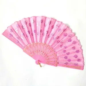 Close-up detail of a pink folding fan featuring elegant shimmering sequins and floral embroidery