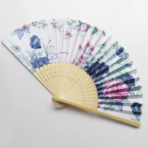 Detailed view of Japanese floral satin folding fan with decorative bamboo ribs.