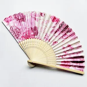Exquisite Japanese style folding fan featuring pink floral satin cloth and wood ribs