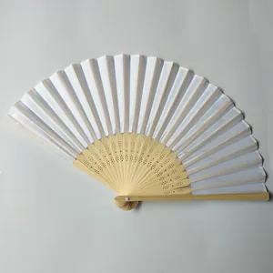 Detail view of an elegant white silk folding fan showing intricate hollow bamboo ribs