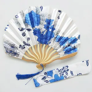 Blue floral folding fan set with matching pouch and elegant tassel decoration.