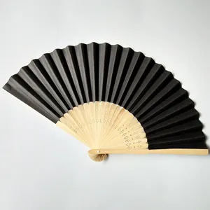 Elegant black folding paper fan with natural wooden ribs for wedding events and DIY
