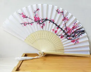 Traditional white silk folding fan featuring pink plum blossom painting and a white tassel